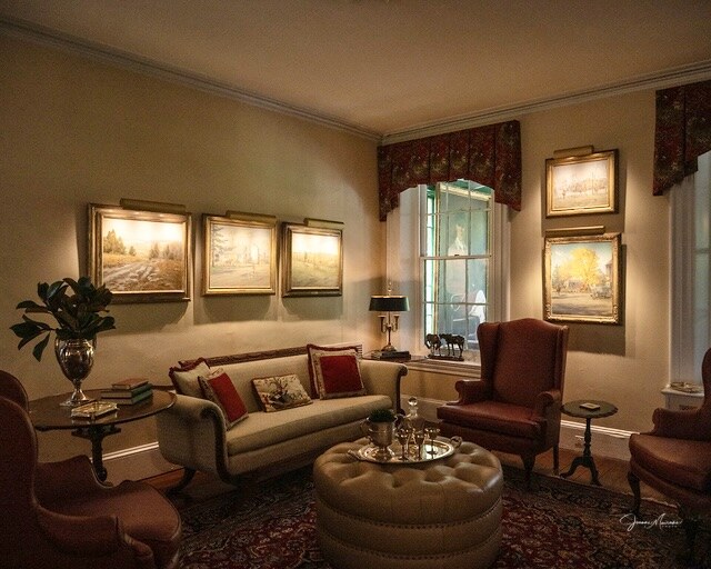 Room with sofa, chairs, and ottoman,