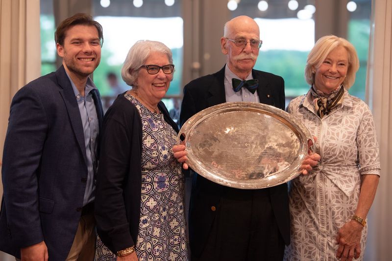 Four people with trophy